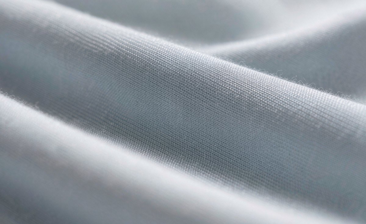 Smooth ice silk knit fabric surface with a subtle cool sheen - GorgeousBen ice silk pants fabric guide