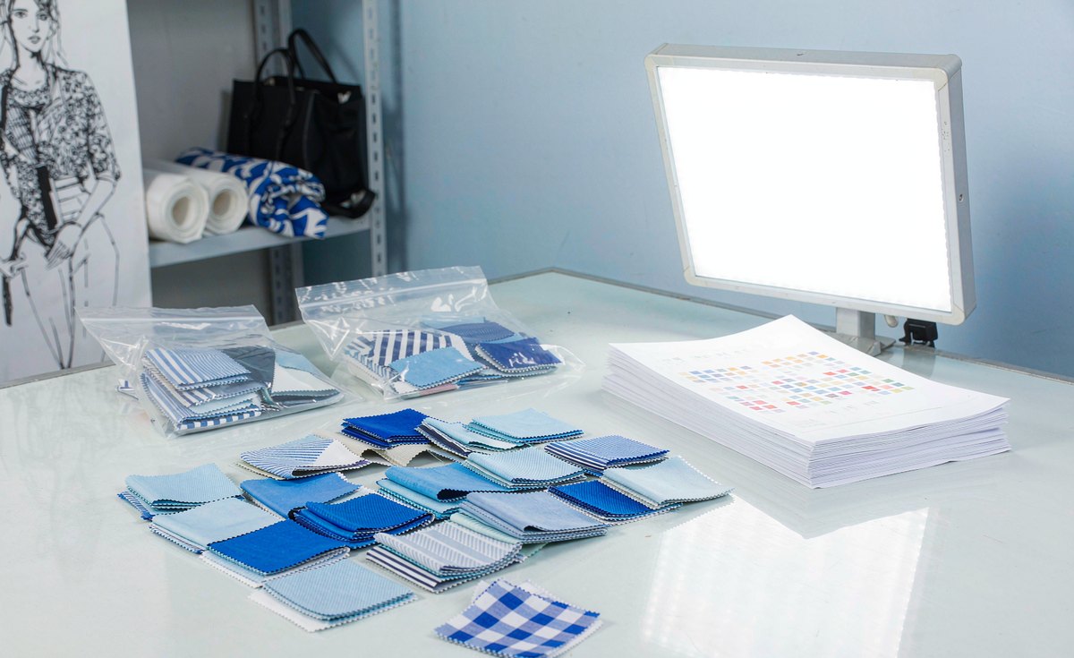 GorgeousBen fabric lead time - lab dip swatches in shades of blue awaiting buyer approval